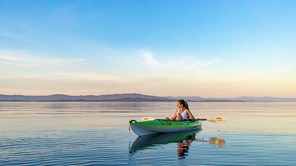 Woman kayaking alone
