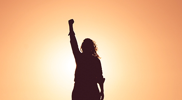 A woman raising her fist in triumph