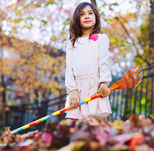 A child raking leaves