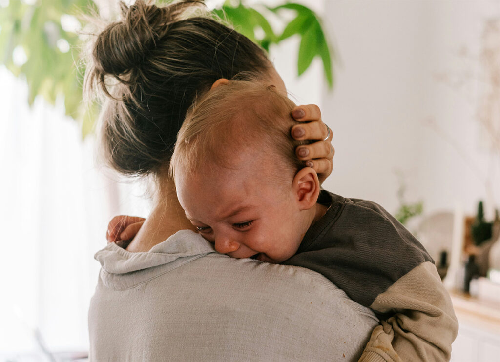 A crying baby and mother